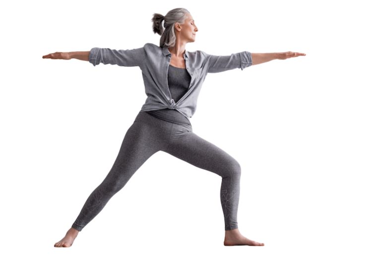middle aged lady doing a warrior pose to shoe balance training benefits