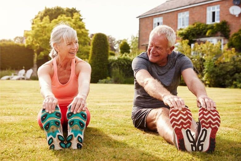 A couple stretching after walking