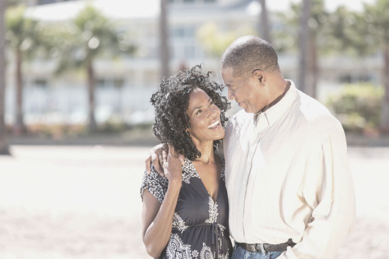 Middle age black couple shoeing each other affection