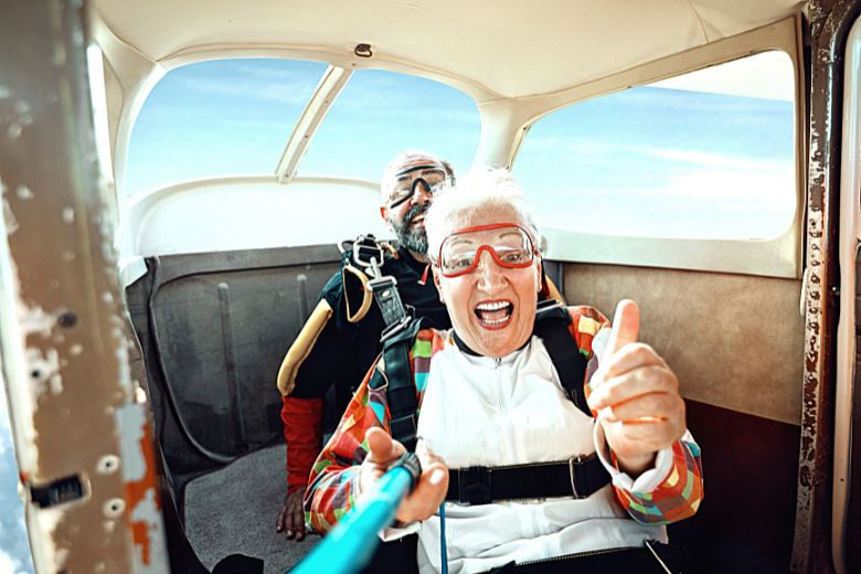 Over 50s woman about to do a tandem sky dive