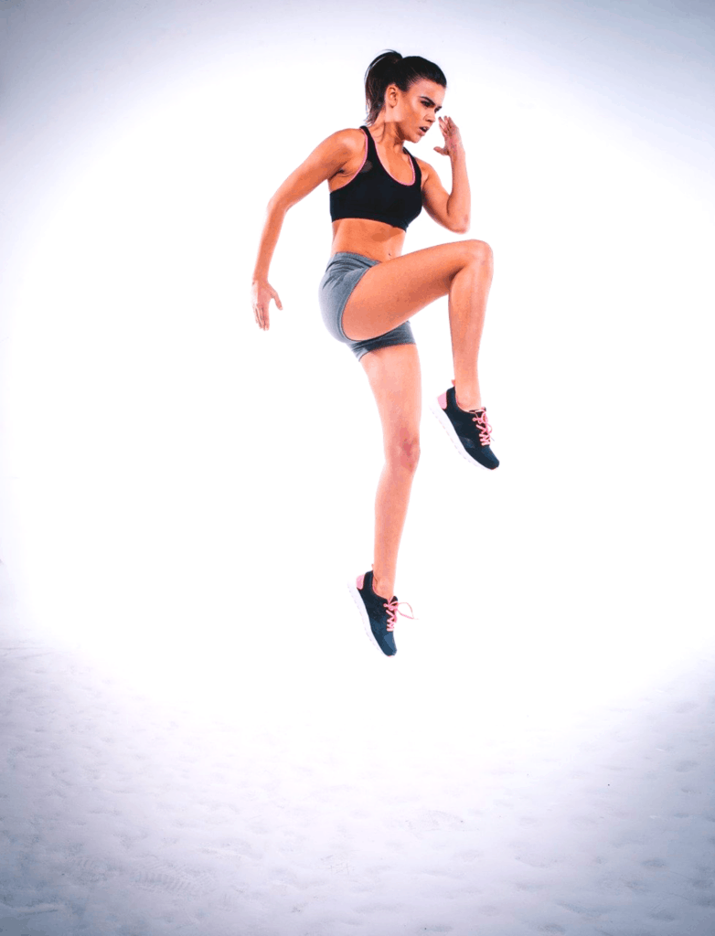 Girl jumping with a high impact sports bra