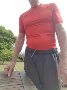 Me with an Under Armour compression shirt helping pull in the tummy