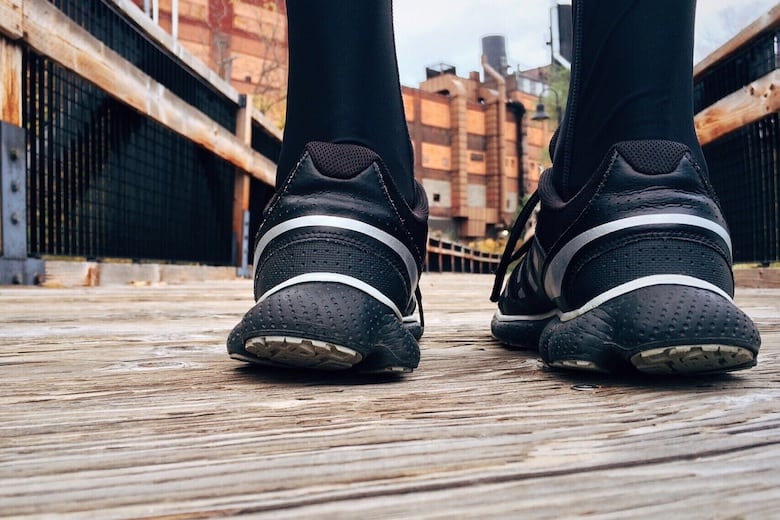 The heels of sports shoes with a background of industrial style hoka vs brooks