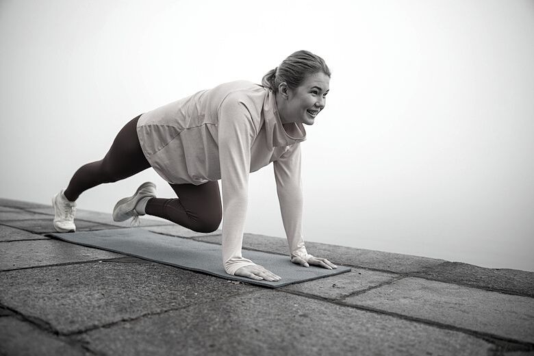 Girl outside doing mountain climbers an exercise to engage your core