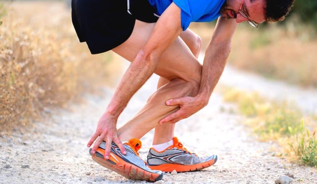 Runner stopped and holding his heel