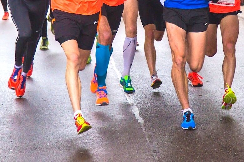 lower halves of 6 running men showing their different taste for shoes and shorts